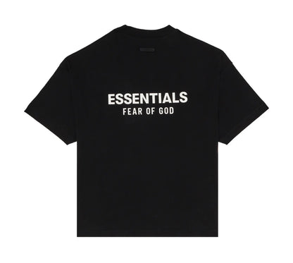 A black short-sleeve t-shirt with 'ESSENTIALS FEAR OF GOD' printed in white text across the chest, displayed flat against a solid white background.