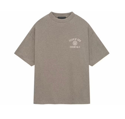 A heather taupe gray short-sleeve t-shirt with a small white 'Fear of God Essentials' logo printed on the left chest, displayed flat against a solid white background.